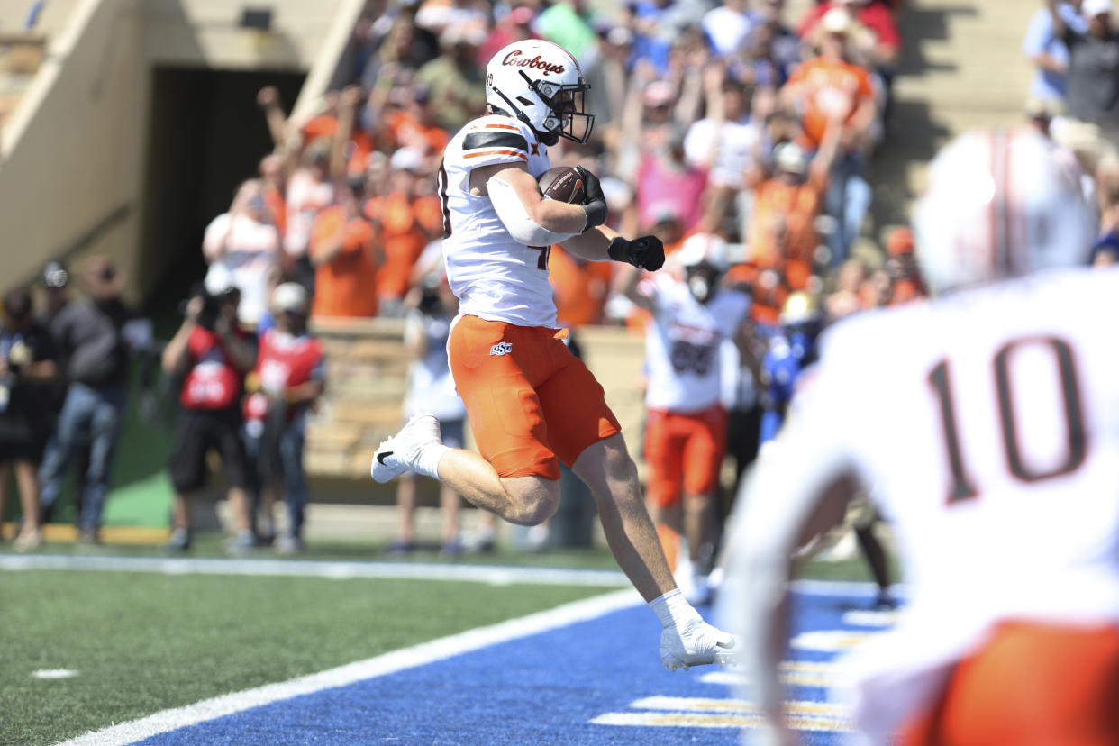 Oklahoma State tight end Josh Ford (40) steps over the goal line scoring a touchdown against Tulsa during the first half of an NCAA college football game, Saturday, Sept. 14, 2024, in Tulsa, Okla. (AP Photo/Joey Johnson)