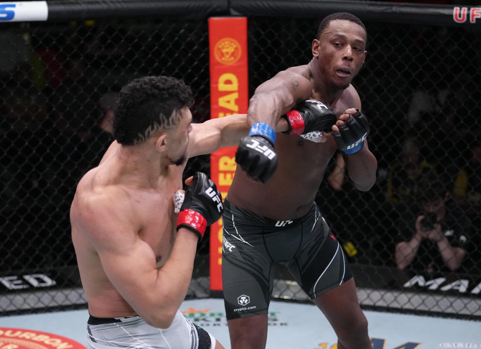 LAS VEGAS, NEVADA - FEBRUARY 19: (R-L) Jamahal Hill and Johnny Walker of Brazil trade punches in their light heavyweight fight during the UFC Fight Night event at UFC APEX on February 19, 2022 in Las Vegas, Nevada. (Photo by Jeff Bottari/Zuffa LLC)