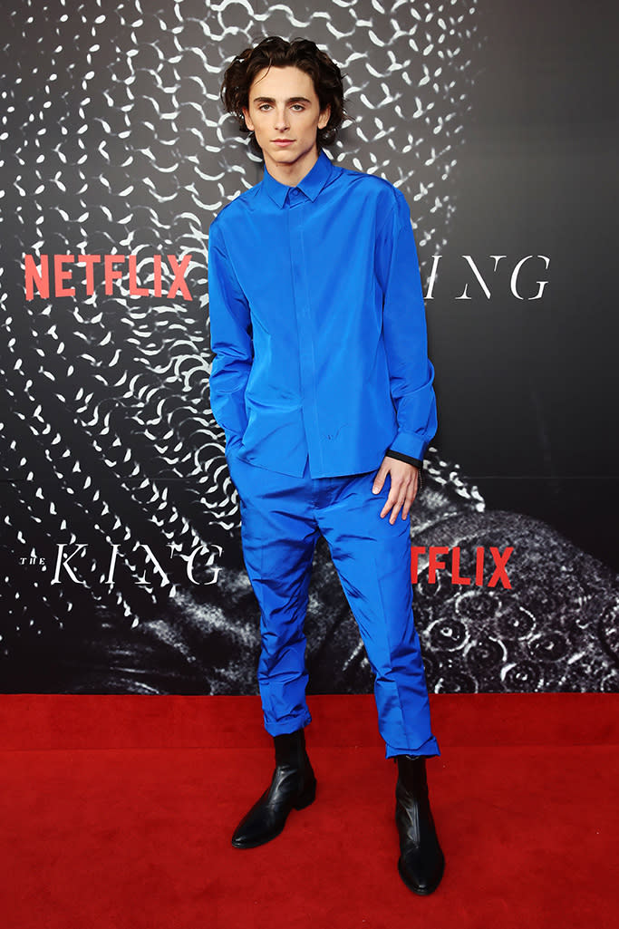 Timothée Chalamet goes electric blue in this Haider Ackermann look for the Australian premiere of the movie “The King.” - Credit: BRENDON THORNE/Shutterstock