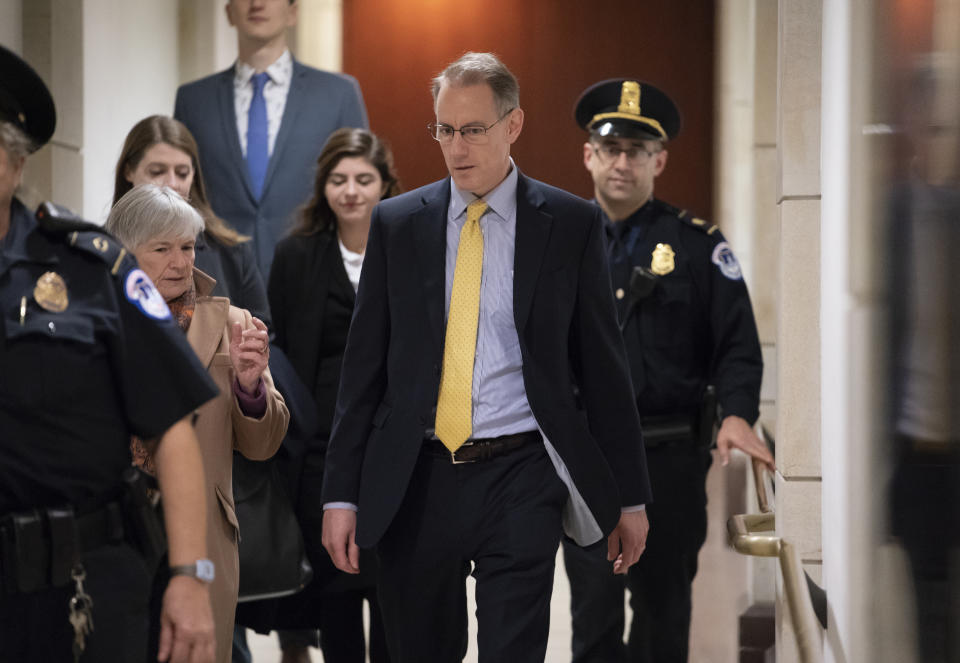 Mark Sandy, a career employee in the White House Office of Management and Budget, arrives at the Capitol to testify in the House Democrats' impeachment inquiry about President Donald Trump's effort to tie military aid for Ukraine to investigations of his political opponents, in Washington, Saturday, Nov. 16, 2019. (AP Photo/J. Scott Applewhite)