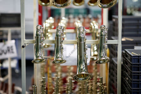 Saxophones are displayed at the Henri Selmer wind instruments factory in Mantes-la-Ville near Paris, France, January 17, 2018. REUTERS/Benoit Tessier