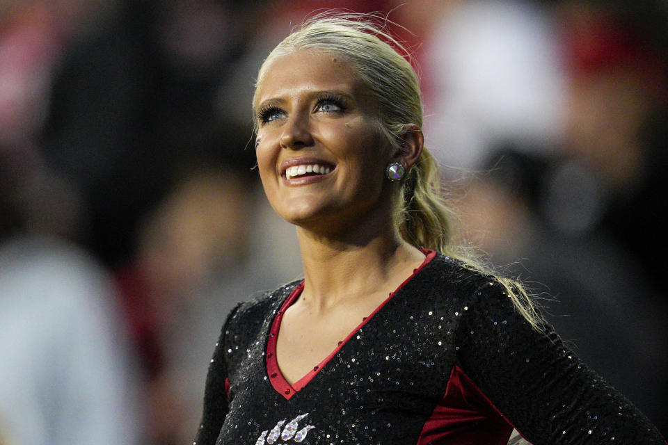 A Cincinnati cheerleader performs on the sideline during an NCAA college football game against Navy, Saturday, Nov. 5, 2022, in Cincinnati. (AP Photo/Jeff Dean)