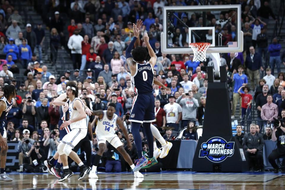 Gonzaga guard Julian Strawther shoots a long three-pointer with seconds left to play.