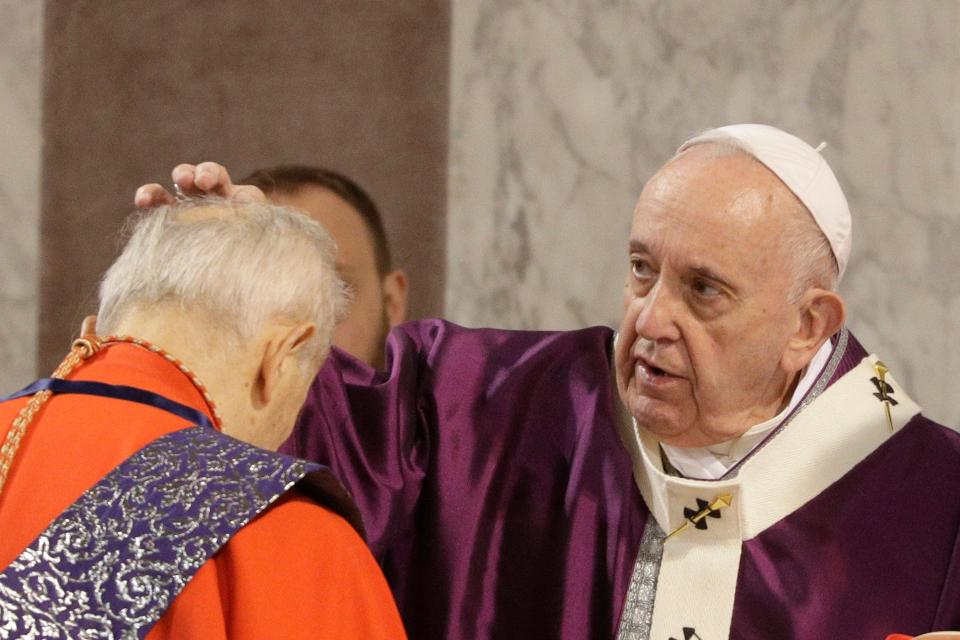 Pope Francis puts ashes on the forehead of Cardinal Jozef Tomko in the Santa Sabina Basilica during the Ash Wednesday Mass opening Lent, the forty-day period of abstinence and deprivation for Christians before Holy Week and Easter. (AP Photo/Gregorio Borgia)