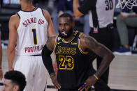 Los Angeles Lakers' LeBron James (23) reacts to a call during the first half of an NBA conference final playoff basketball game against the Denver Nuggets Sunday, Sept. 20, 2020, in Lake Buena Vista, Fla. (AP Photo/Mark J. Terrill)