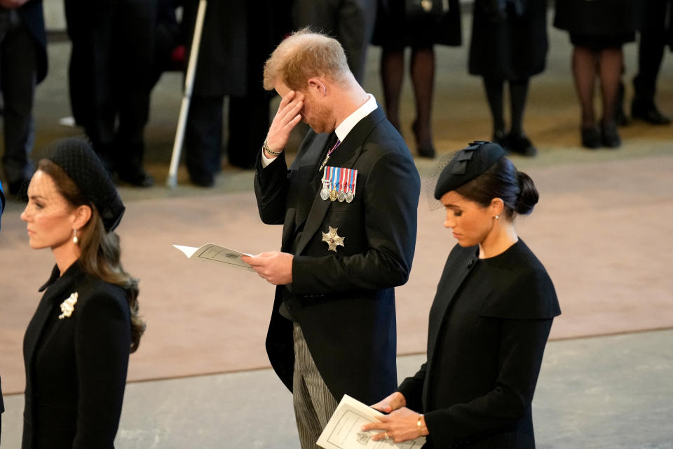 <p>LONDON, ENGLAND - SEPTEMBER 14: Catherine, Princess of Wales, Prince Harry, Duke of Sussex and Meghan, Duchess of Sussex pay their respects in The Palace of Westminster after the procession for the Lying-in State of Queen Elizabeth II on September 14, 2022 in London, England. Christopher Furlong/Pool via REUTERS</p> 