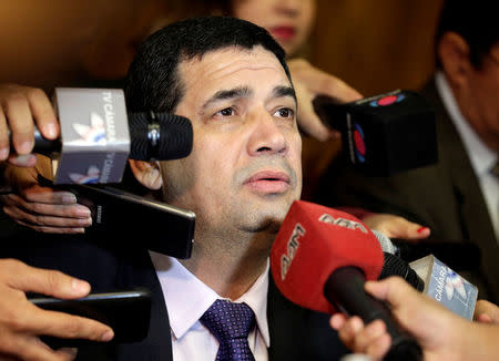 Hugo Velazquez, President of the Lower House of Congress, talks to the press before a session in Asuncion, Paraguay April 26, 2017. REUTERS/Jorge Adorno