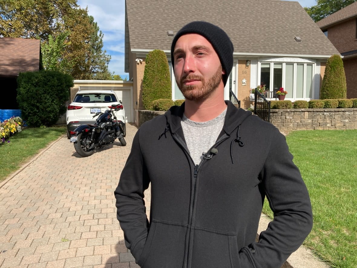 Tommy Kontos was working on his computer in his Toronto home Tuesday morning when he suddenly saw the lights of his 2022 Jeep flash through his window. Minutes later, he was carjacked at gunpoint. (Michael Aitkens/CBC - image credit)