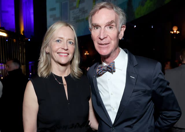 <p>Monica Schipper/Getty</p> Liza Mundy and Bill Nye in 2022.