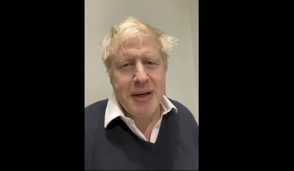 This is grab taken from video from the twitter feed of Britain's Prime Minister Boris Johnson posted on Monday, Nov, 16, 2020. Johnson says he is as “fit as a butcher’s dog” and remains in charge despite being instructed to self-isolate for 14 days after meeting a lawmaker who has tested positive for the coronavirus. Johnson said in a Twitter video message that he has no COVID-19 symptoms and will continue to govern using “Zoom and other forms of electronic communication.” (Boris Johnson/Twitter via AP)