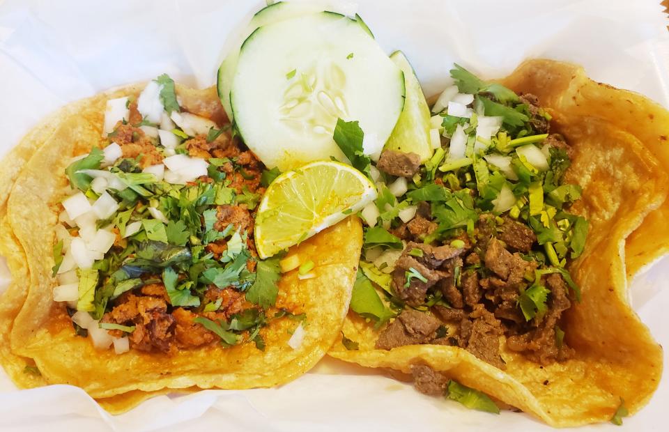 Tacos with double corn tortillas are served by La Poblano food truck.