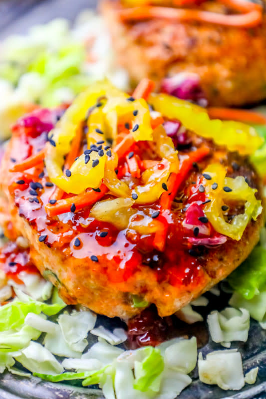 <p>Sweet C's</p><p>These easy-grilled sweet chili Asian salmon burgers are sweet, spicy and loaded with delicious salmon flavor the whole family loves.</p><p><strong>Get the recipe: <a href="https://sweetcsdesigns.com/sweet-chili-asian-salmon-burgers-recipe/" rel="nofollow noopener" target="_blank" data-ylk="slk:Sweet Chili Asian Salmon Burgers;elm:context_link;itc:0;sec:content-canvas" class="link ">Sweet Chili Asian Salmon Burgers</a></strong></p>