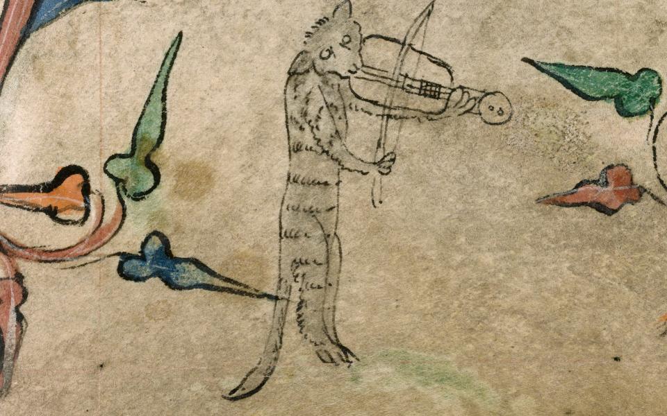 Purrfect pitch: a cat plays a rebec in this detail from a 14th-century Book of Hours - bridgeman
