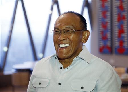 Indonesian President candidate from Golkar Party Aburizal Bakrie gestures during an interview in Jakarta, December 12, 2013.