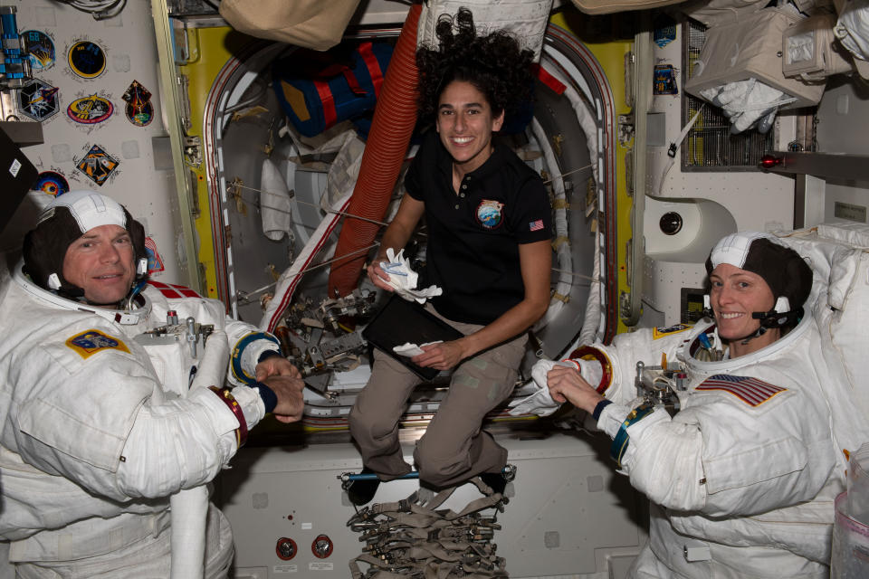 From left: Andreas Mogensen of the European Space Agency, Jasmin Moghbeli  and Loral O'Hara, both of NASA, prepare for an upcoming spacewalk. 