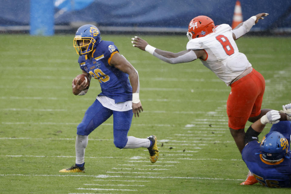 South Dakota State running back Pierre Strong Jr. (20) runs for yardage as Sam Houston State linebacker Quentin Brown (8) defends during the first half of the NCAA college FCS Football Championship in Frisco, Texas, Sunday, May 16, 2021. (AP Photo/Michael Ainsworth)