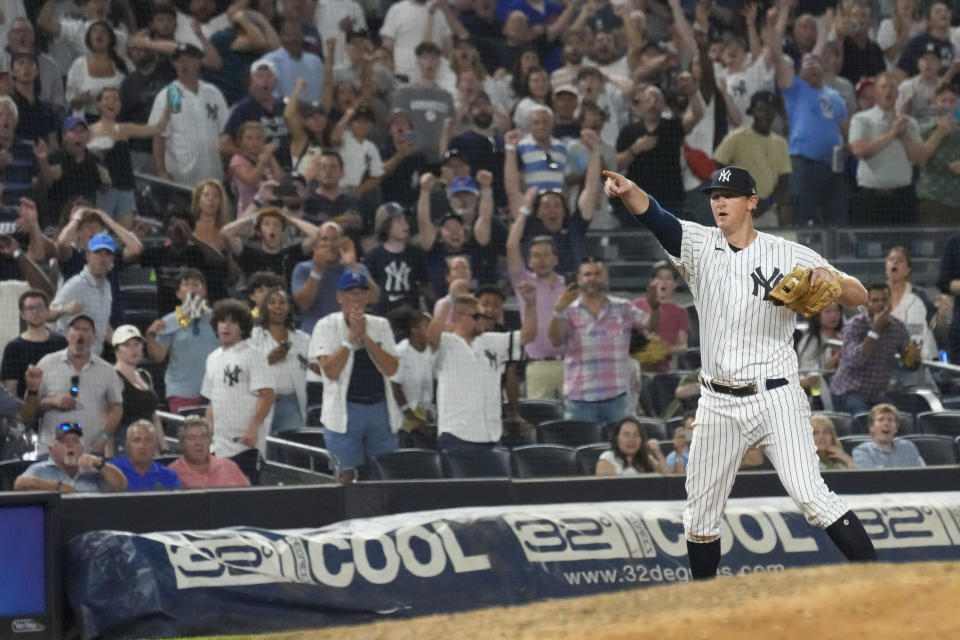 New York Yankees third baseman DJ LeMahieu, right, reacts after tagging Kansas City Royals' Drew Waters for the final out in the ninth inning of a baseball game, Friday, July 21, 2023, in New York. (AP Photo/Mary Altaffer)