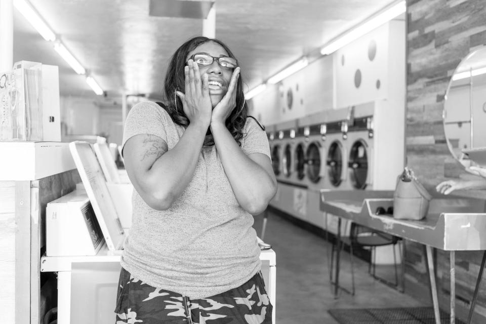 Social Spin Laundromat employee, Hanan Dema, 21, at a laundromat in Phoenix, Ariz. Dema is aged-out foster teen.