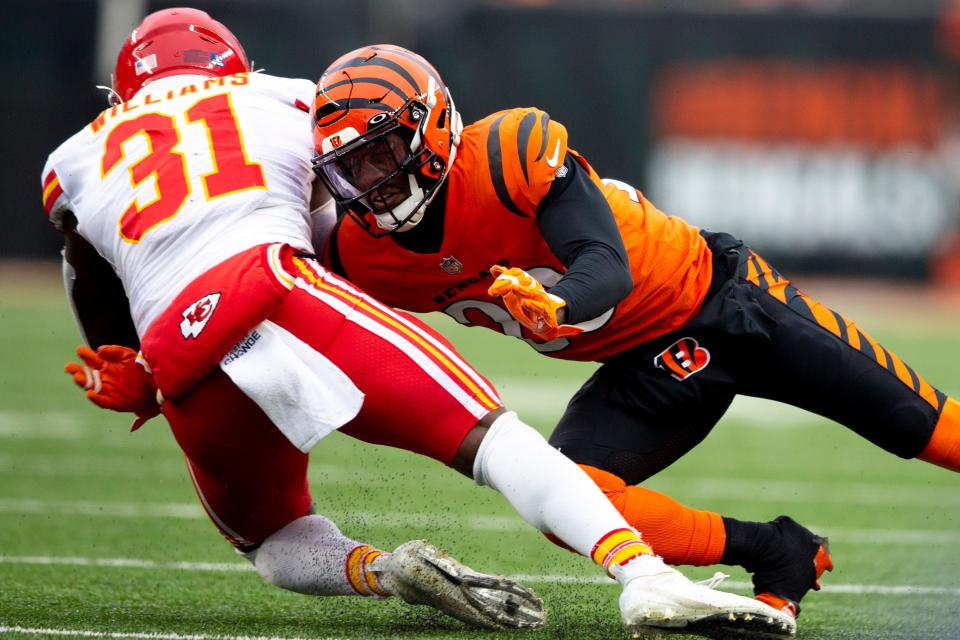 Cincinnati Bengals cornerback Eli Apple (20) tackles Kansas City Chiefs running back Darrel Williams (31) in the second half of the NFL game on Sunday, Jan. 2, 2022, at Paul Brown Stadium in Cincinnati. Cincinnati Bengals defeated Kansas City Chiefs 34-31. 