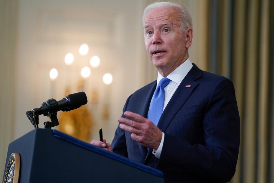 President Joe Biden takes questions from reporters as he speaks about the American Rescue Plan, in the State Dining Room of the White House on Wednesday.