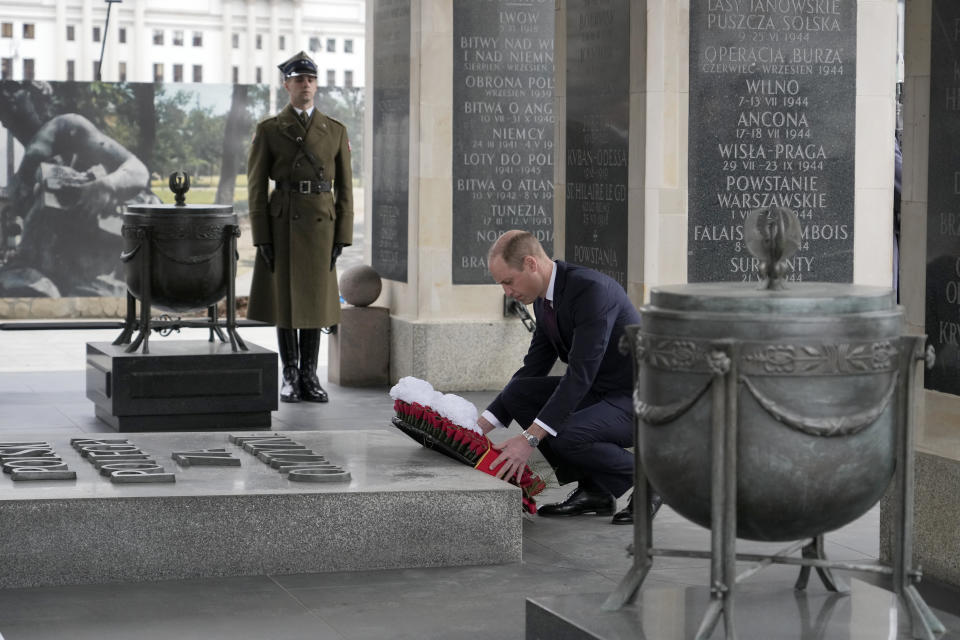 Britain's Prince William lays a wreath of flowers at the Tomb of the Unknown Soldier in Warsaw, Poland, Thursday, March 23, 2023. (AP Photo/Czarek Sokolowski)