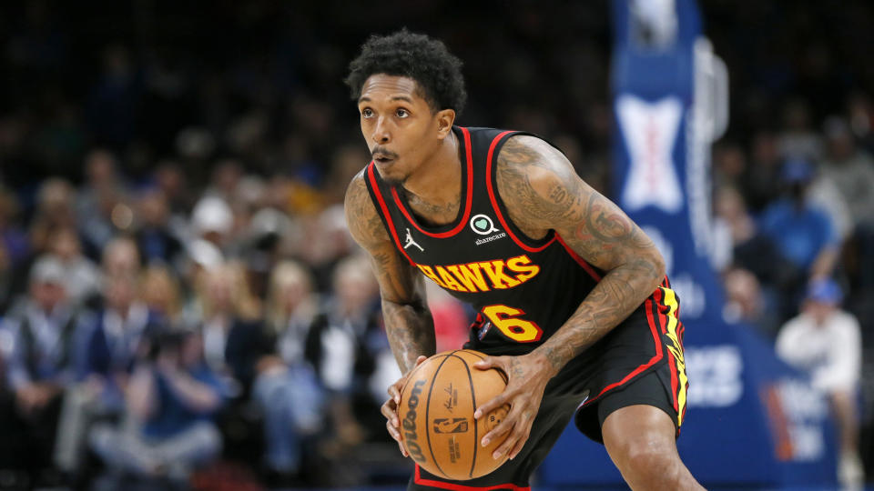 FILE - Atlanta Hawks guard Lou Williams holds the ball during the first half of an NBA basketball game against the Oklahoma City Thunder, March 30, 2022, in Oklahoma City. Williams announced his retirement from the NBA on Sunday, June 18, 2023 ending a career where he won the league’s Sixth Man award three times and scored more points off the bench than anyone in history. (AP Photo/Nate Billings, file)