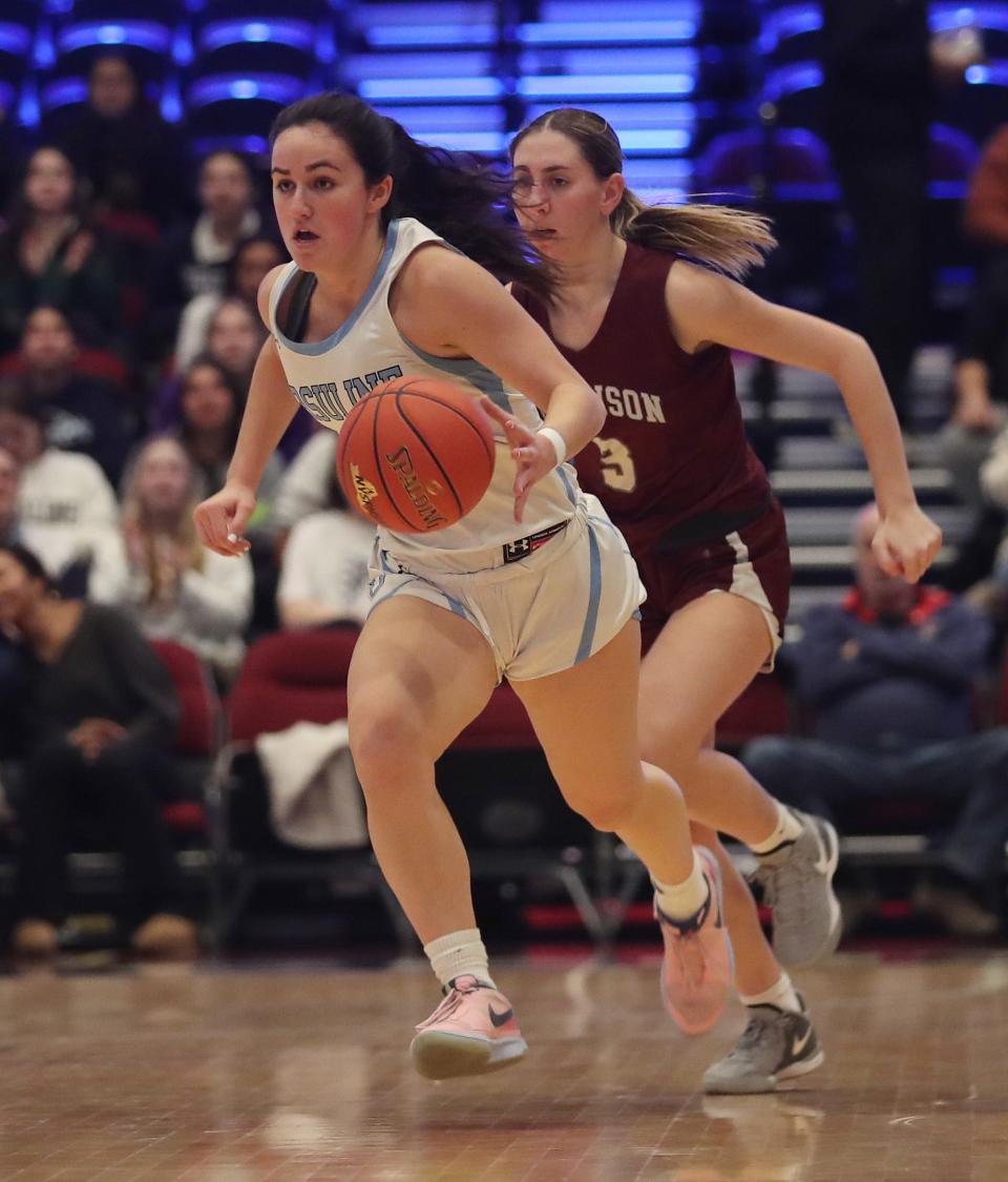 Ursuline's Sophie Nascimento (10) heads up the court on a fast break against Harrison during the Section1 Class AA girls basketball semifinal at the Westchester County Center in White Plains Feb. 27, 2024.