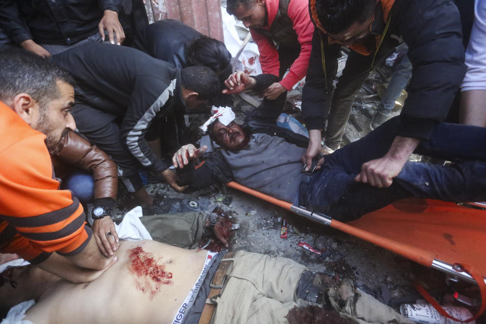 Palestinians rescue survivors after an Israelikm strike on Shaheen family house in Rafah, Gaza Strip, Saturday, Feb. 24, 2024. (AP Photo/Hatem Ali)