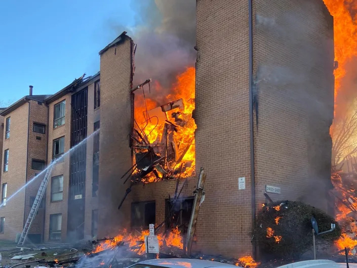 Flames billow out of an exploded apartment block in Silver Spring, Montgomery County, Maryland