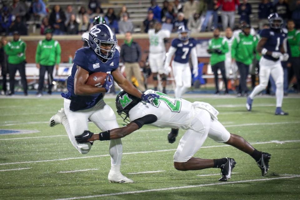 Georgia Southern running back OJ Arnold eludes a Marshall defensive back in fourth-quarter action  at Paulson Stadum on Saturday night.  Arnold rushed for 50 yards on seven carries.