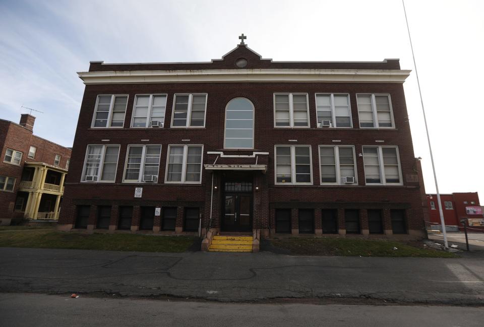 The former Holy Apostles school building at Lyell Avenue and Austin Street.