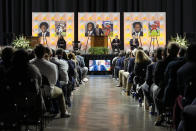 FILE - University of Virginia football coach Tony Elliott speaks during a memorial service for three slain University of Virginia football players, Lavel Davis Jr., D'Sean Perry and Devin Chandler at John Paul Jones Arena at the school in Charlottesville, Va., Saturday, Nov. 19, 2022. The Virginia Cavaliers finally are getting back on a field to play. Saturday's opener against Tennessee will be both teams first game in 294 days. They're trying to move on from a shooting that left three players dead and ended their season early.(AP Photo/Steve Helber, Pool, File)