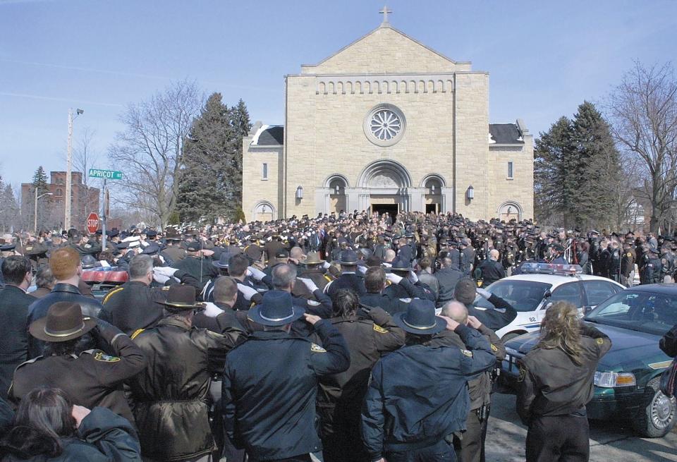 More than 1,000 law enforcement officers gather outside SS. Peter and Paul Catholic Church in Wisconsin Rapids during Adams County Deputy Michael Shannon's Funeral.