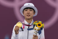 FILE - First placed South Korea's An San celebrates on the podium of the women's individual competition at the 2020 Summer Olympics, Friday, July 30, 2021, in Tokyo, Japan. (AP Photo/Alessandra Tarantino, File)