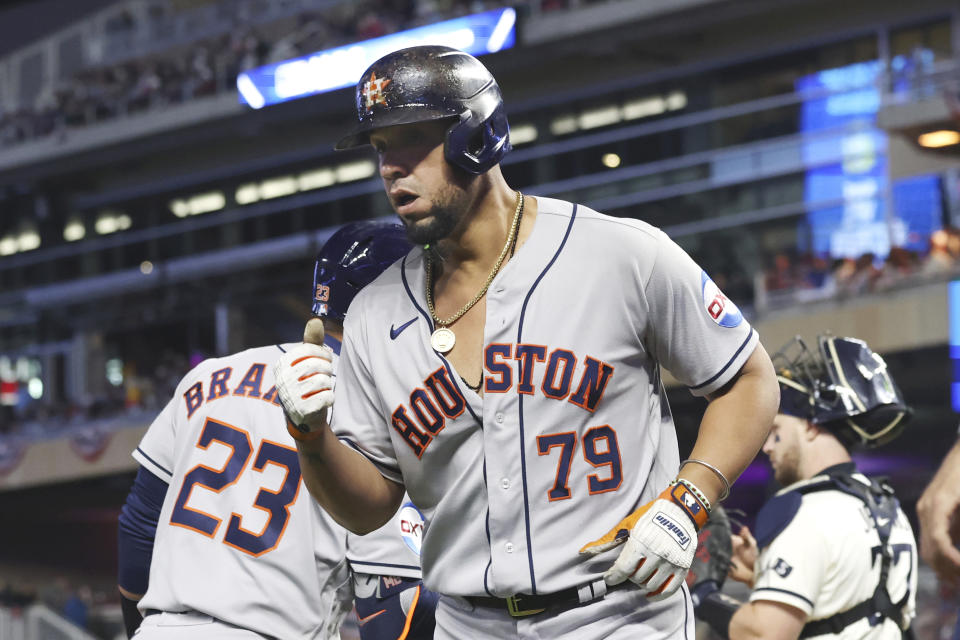 Houston Astros' Jose Abreu reacts after a two-run home run during the fourth inning of Game 4 of a baseball AL Division Series against the Minnesota Twins, Wednesday, Oct. 11, 2023, in Minneapolis. (AP Photo/Stacy Bengs)