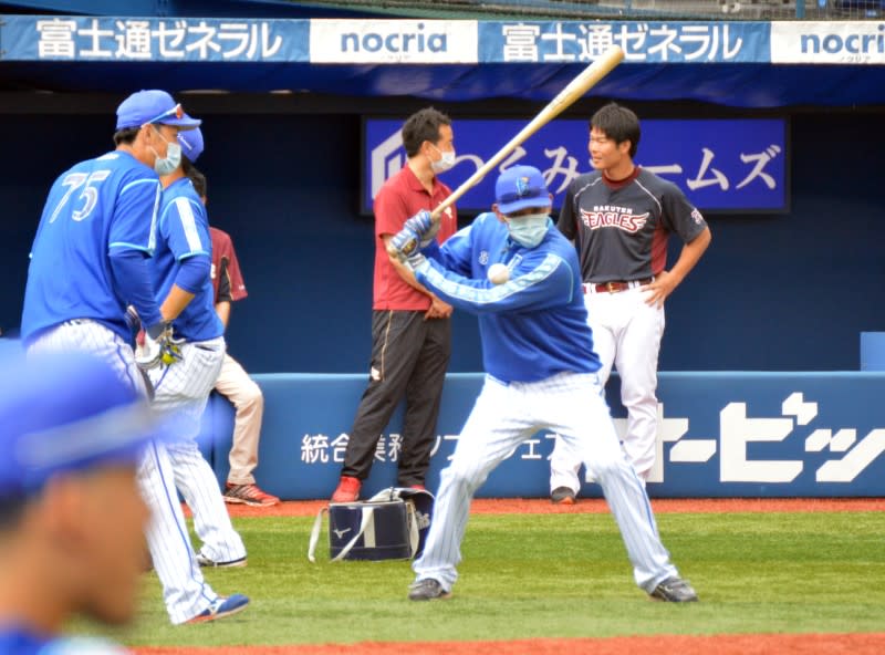 Team members of Yokohama DeNA BayStars and Tohoku Rakuten Golden Eagles are seen before their practice baseball game amid the coronavirus disease (COVID-19) outbreak, in Yokohama, Japan