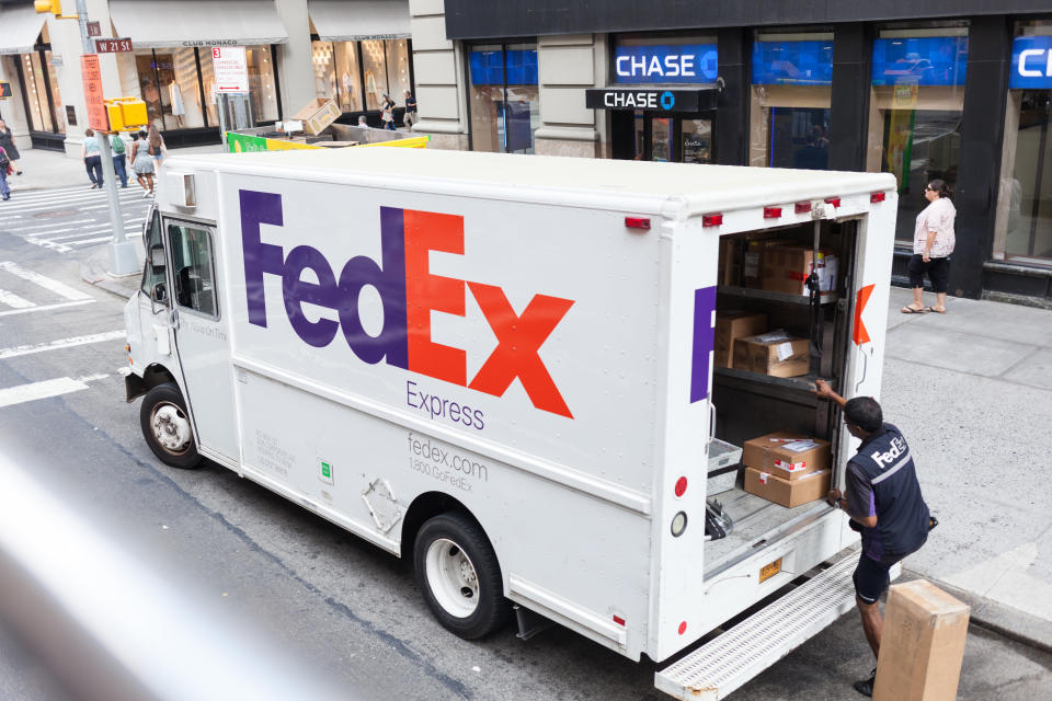 New York City, NY, USA - July 7, 2015:  FedEx Express truck in midtown Manhattan. FedEx is one of the leading package delivery services offering many different delivery options.