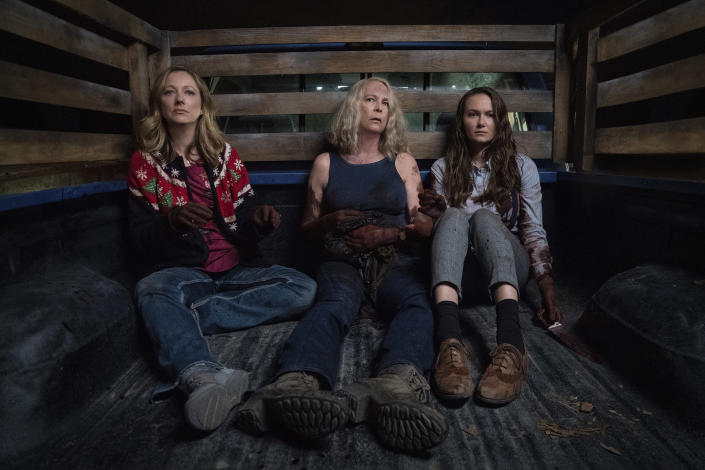 This image released by Universal Pictures shows Judy Greer, from left, Jamie Lee Curtis and Andi Matichak in "Halloween Kills," directed by David Gordon Green. (Ryan Green/Universal Pictures via AP)