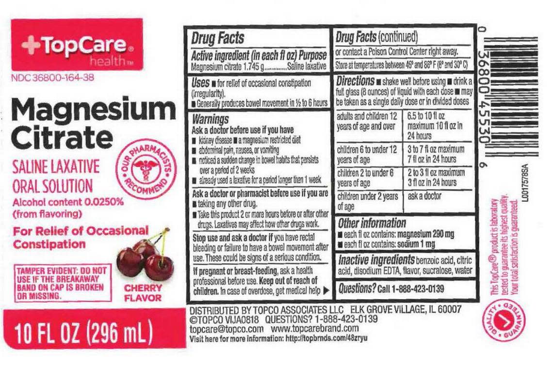 A deconstructed box of TopCare Magnesium Citrate laxative, cherry flavor.