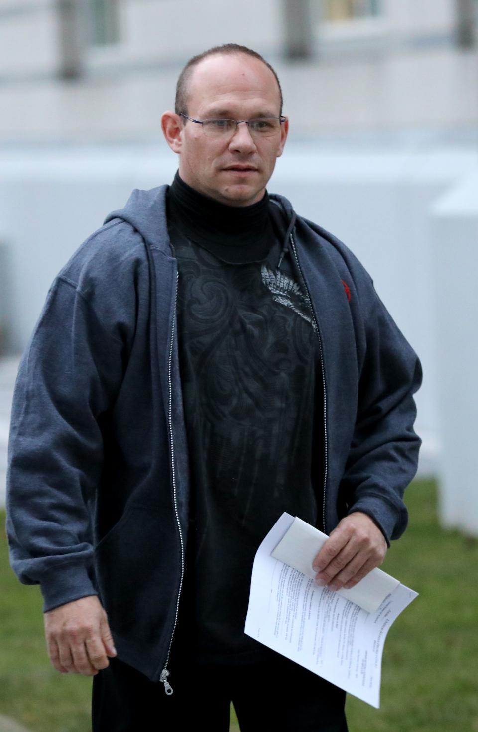 Paterson Police Sgt. Michael Cheff, is shown seconds after walking out of federal court, in Newark. Cheff was there after being arrested by the FBI Tuesday morning, January 7, 2020.  Cheff is the eighth member of the Paterson Police Department to get arrested in a corruption probe which started more than three years ago.  Cheff is currently suspended without pay.