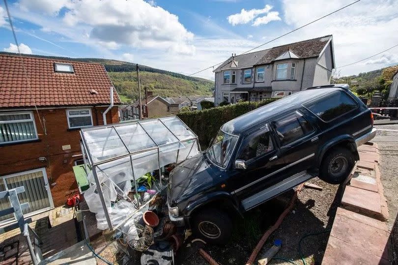 The 4x4 has been left 'dangling' at the top of Martin Herbert's garden for several days