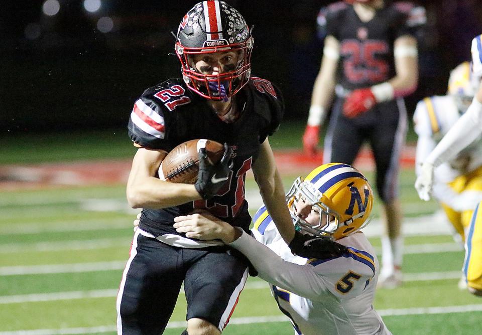 Crestview High School's Adison Reymer (21) carries the ball against Northwood High School during their OHSAA Division VI first round playoff football game on Saturday, October 30, 2021 at Crestview High School. TOM E. PUSKAR/TIMES-GAZETTE.COM