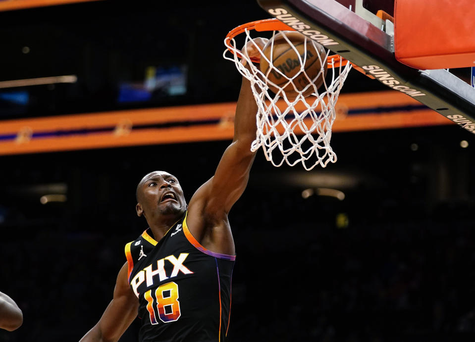 Phoenix Suns' Bismack Biyombo dunks against the Detroit Pistons during the second half of an NBA basketball game in Phoenix, Friday, Nov. 25, 2022. (AP Photo/Darryl Webb)