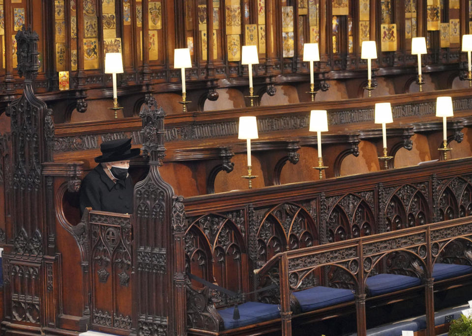 Britain's Queen Elizabeth II sits alone in St. George's Chapel during the funeral of Prince Philip, the man who had been by her side for 73 years, at Windsor Castle, Windsor, England, April 17, 2021. (Jonathan Brady/Pool via AP)