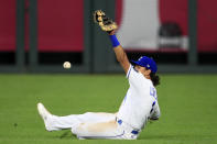 A ball hit by Chicago Cubs Anthony Rizzo gets past Kansas City Royals second baseman Nicky Lopez (1) for a single during the sixth inning of a baseball game at Kauffman Stadium in Kansas City, Mo., Wednesday, Aug. 5, 2020. (AP Photo/Orlin Wagner)