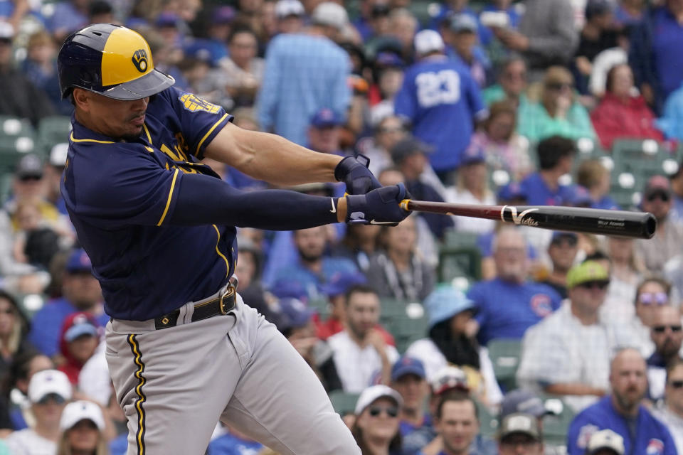 Milwaukee Brewers' Willy Adames hits a single against the Chicago Cubs during the first inning of a baseball game in Chicago, Saturday, Aug. 20, 2022. (AP Photo/Nam Y. Huh)