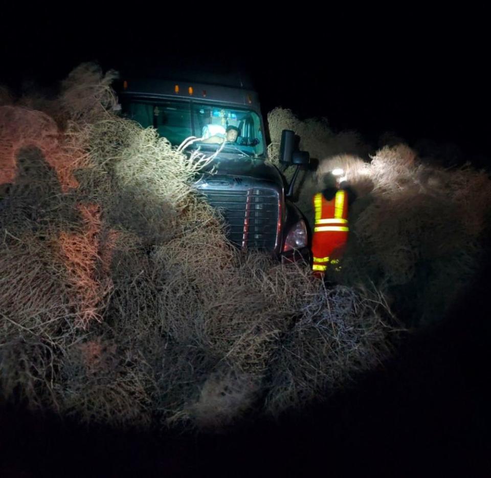 A semi-truck in the tumbleweeds | Chris Thorson/AP/Shutterstock