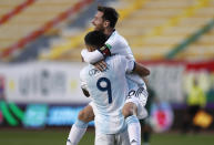 Argentina's Joaquin Correa (9) celebrates with teammate Lionel Messi scoring his side's second goal against Bolivia during a qualifying soccer match for the FIFA World Cup Qatar 2022 in La Paz, Bolivia, Tuesday, Oct. 13, 2020. Argentina won 2-1. (AP Photo/Juan Karita)