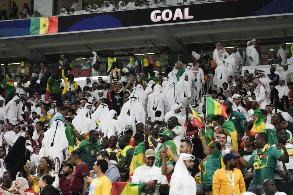 FILE - Qatar fans leave the stadium after Senegal's Bamba Dieng scored a goal during the World Cup group A soccer match between Qatar and Senegal, at the Al Thumama Stadium in Doha, Qatar, Friday, Nov. 25, 2022. (AP Photo/Hassan Ammar, File)