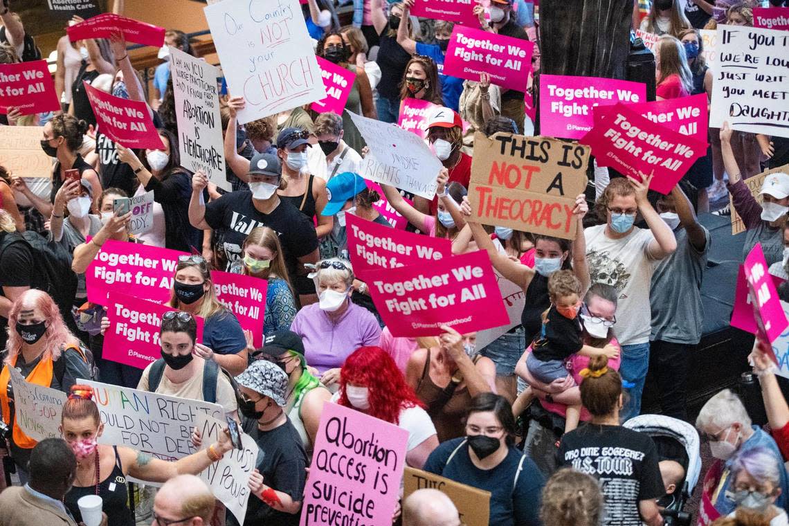 Protestors who support abortion access hold signs in the South Carolina State House lobby on Tuesday, June 28, 2022. While the House was not voting on abortion issues Tuesday, protestors were motivated by last week’s Supreme Court decision letting states decide their own laws on abortion restrictions.